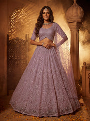 Elegant Mauve Net Lehenga Choli with Crystal Motif Work & Embroidered Dupatta