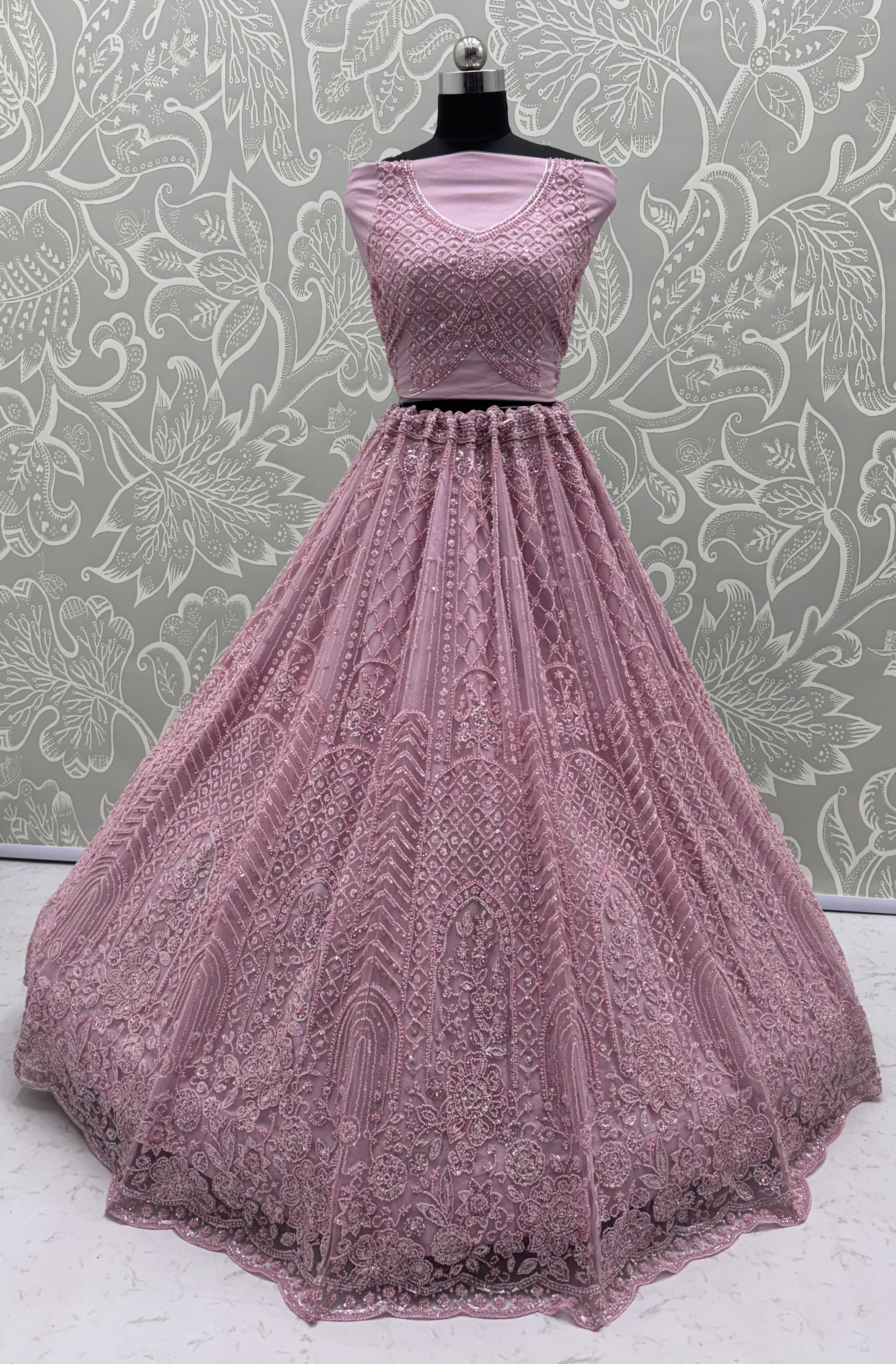 Intricate motifs and Beautiful Patterned Sequence arranged in Partywear Handwork Lehenga Chol