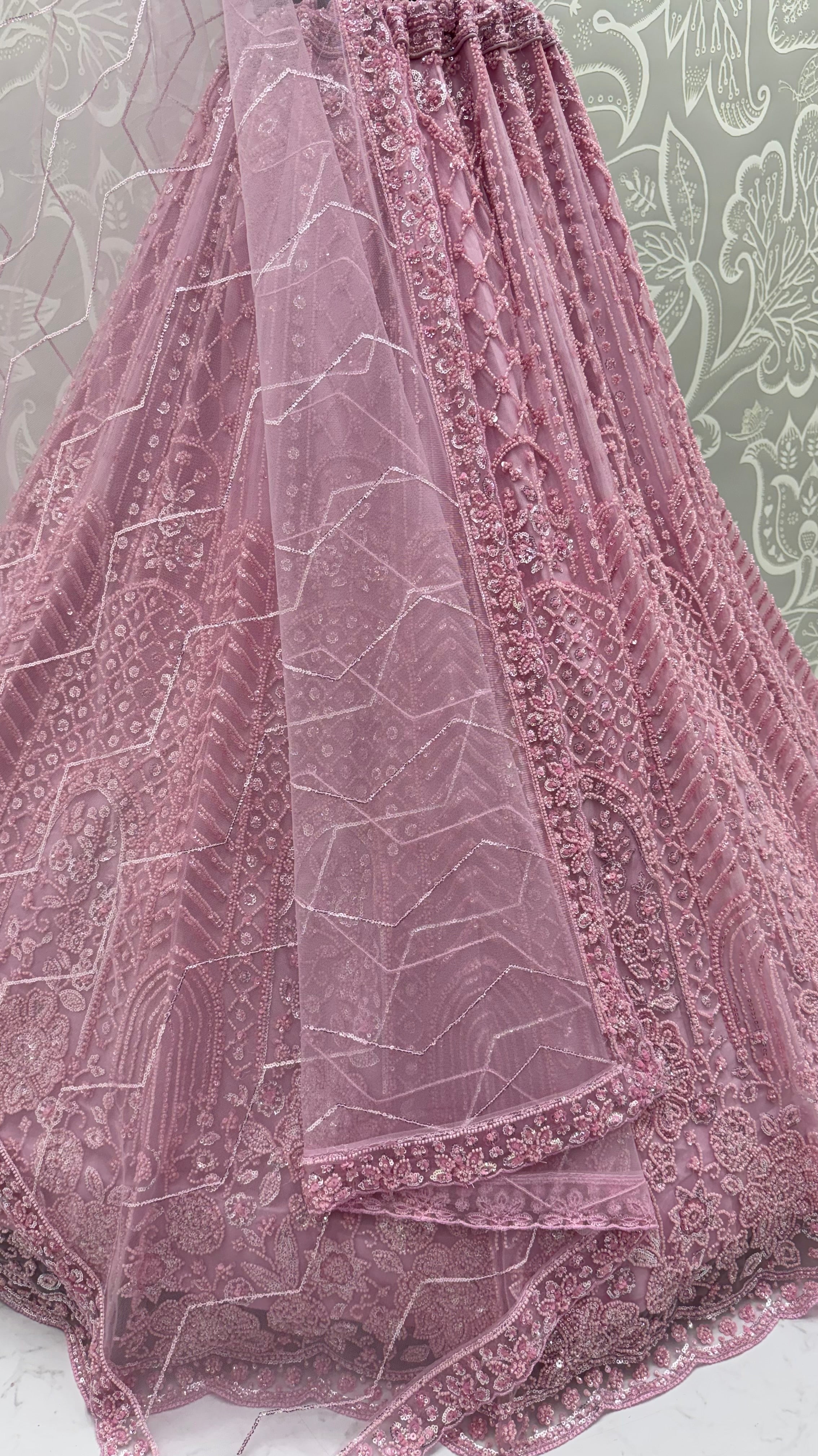 Intricate motifs and Beautiful Patterned Sequence arranged in Partywear Handwork Lehenga Chol