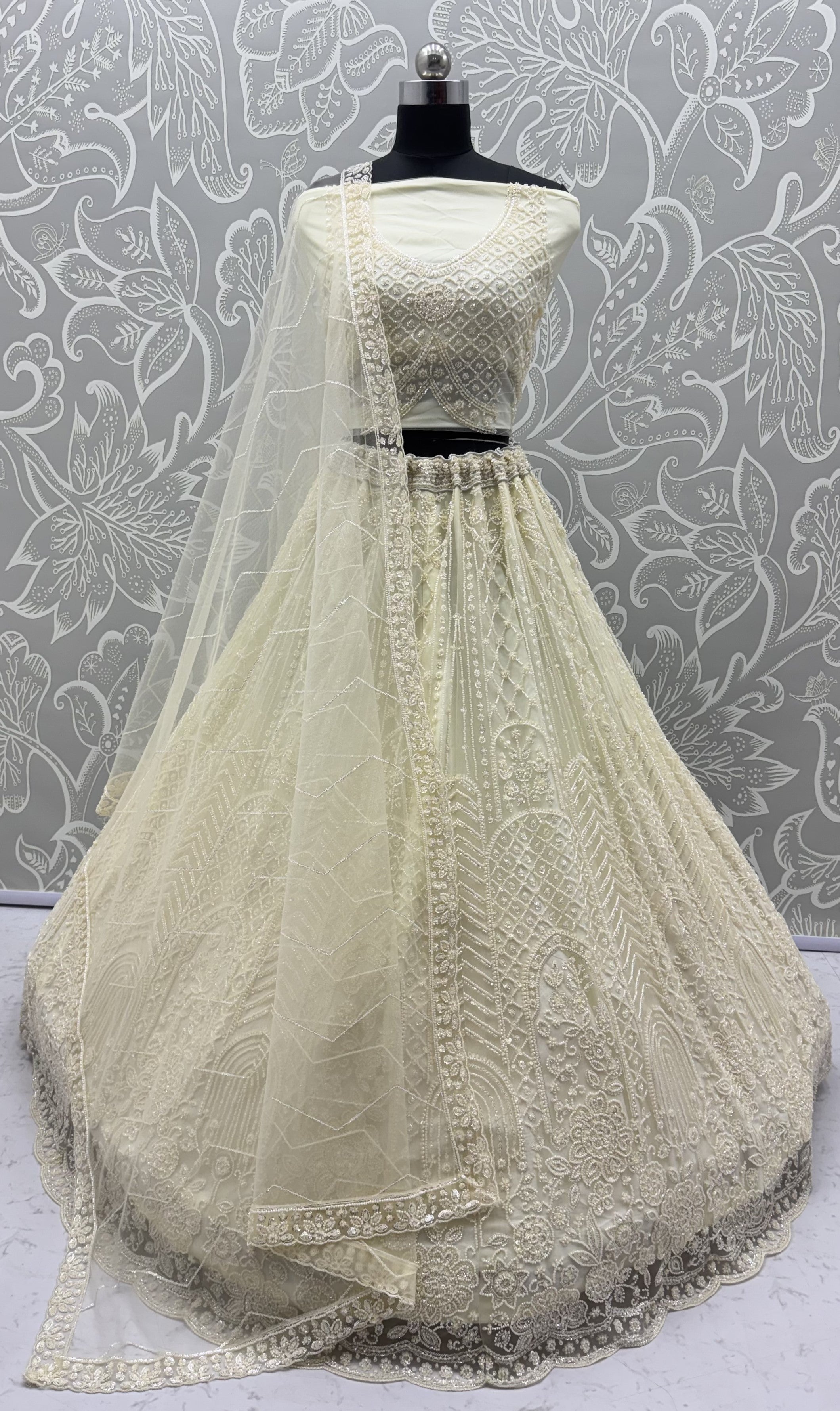 Intricate motifs and Beautiful Patterned Sequence arranged in Partywear Handwork Lehenga Chol