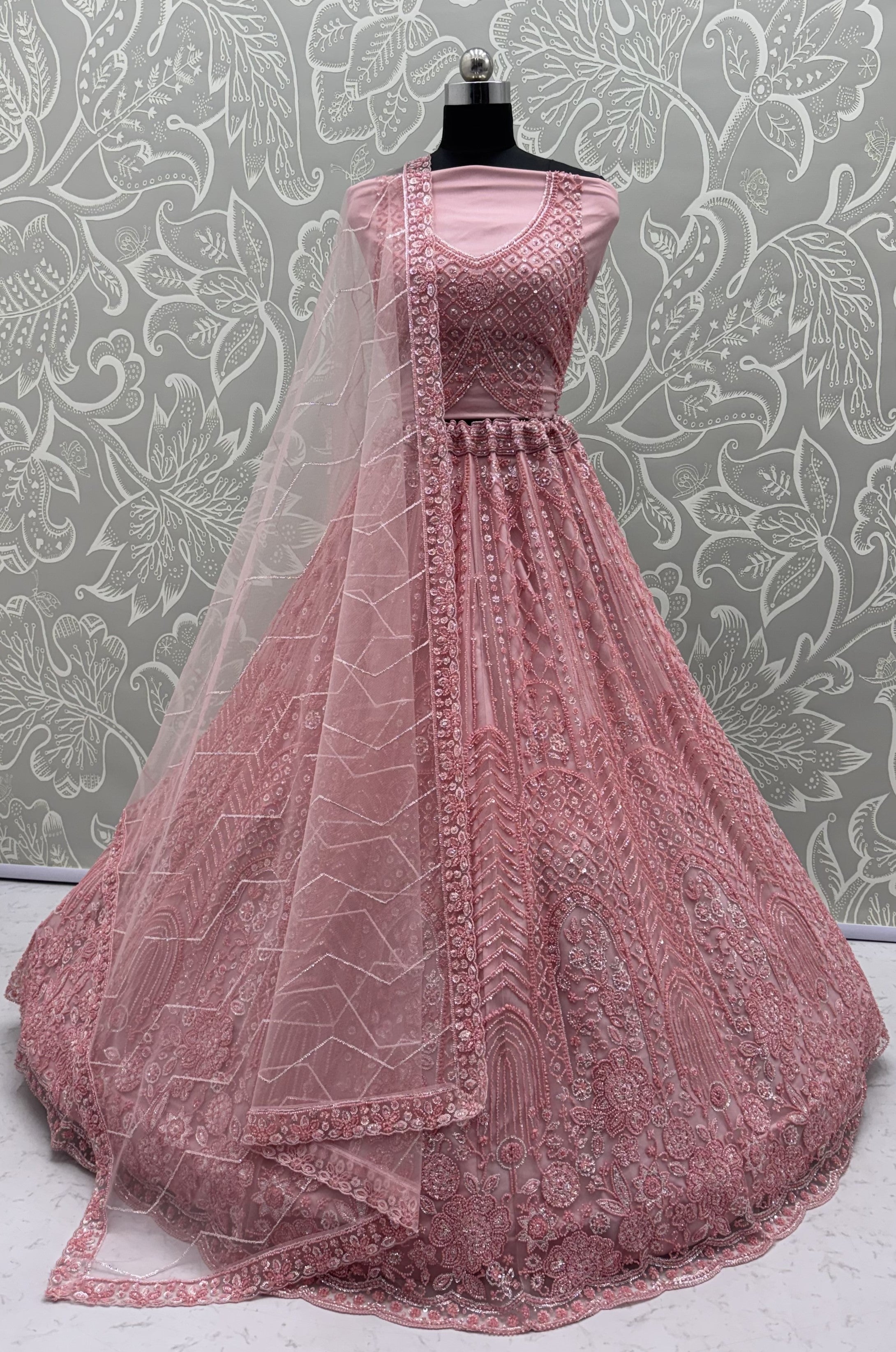 Intricate motifs and Beautiful Patterned Sequence arranged in Partywear Handwork Lehenga Chol