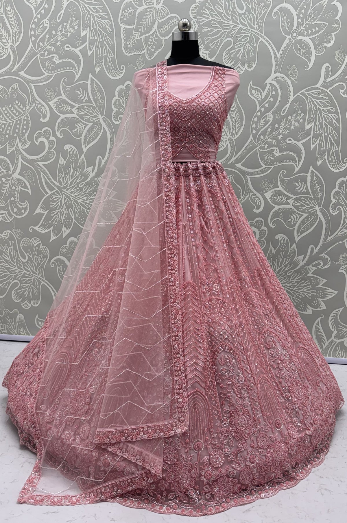 Intricate motifs and Beautiful Patterned Sequence arranged in Partywear Handwork Lehenga Chol
