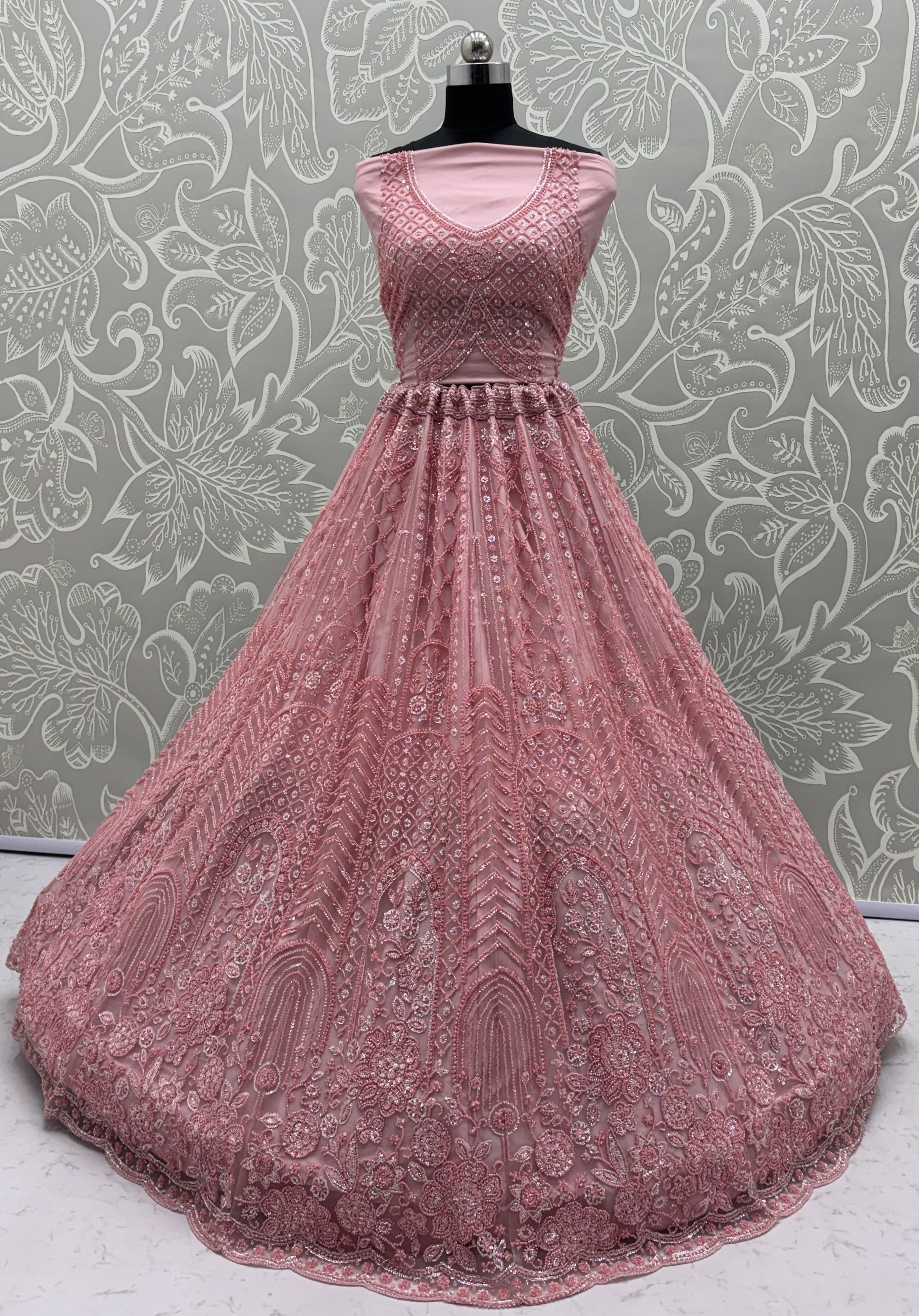 Intricate motifs and Beautiful Patterned Sequence arranged in Partywear Handwork Lehenga Chol