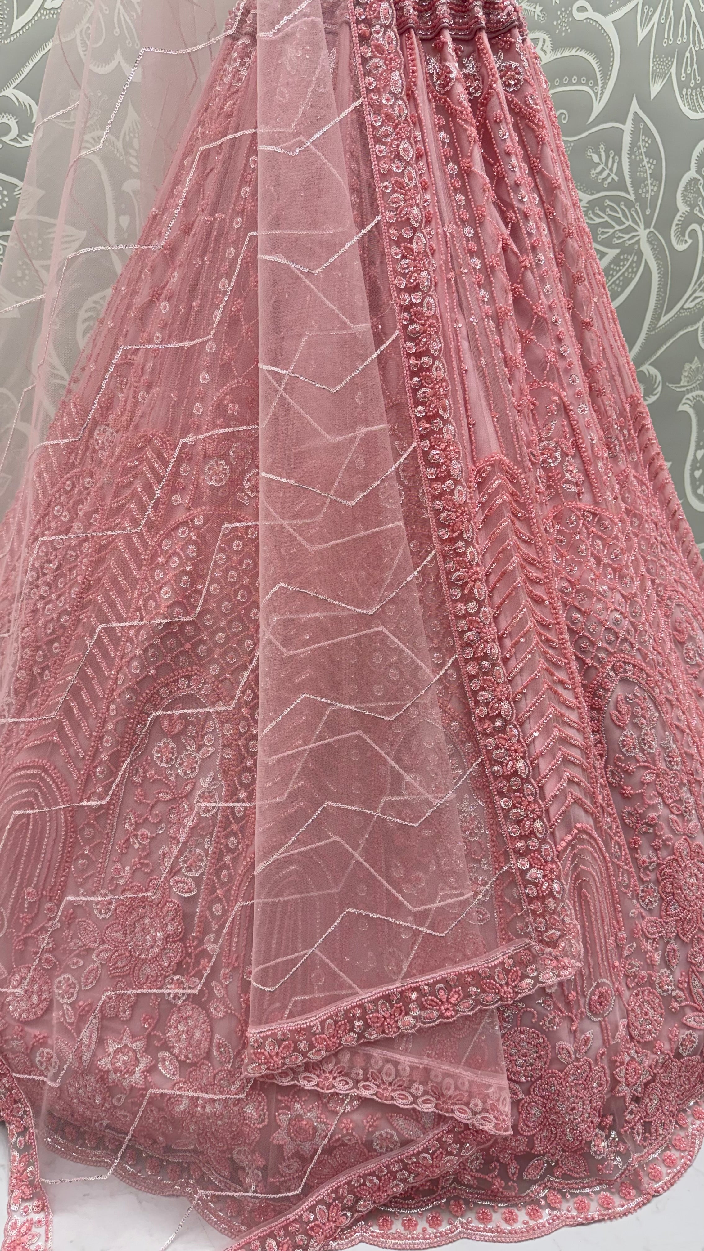 Intricate motifs and Beautiful Patterned Sequence arranged in Partywear Handwork Lehenga Chol