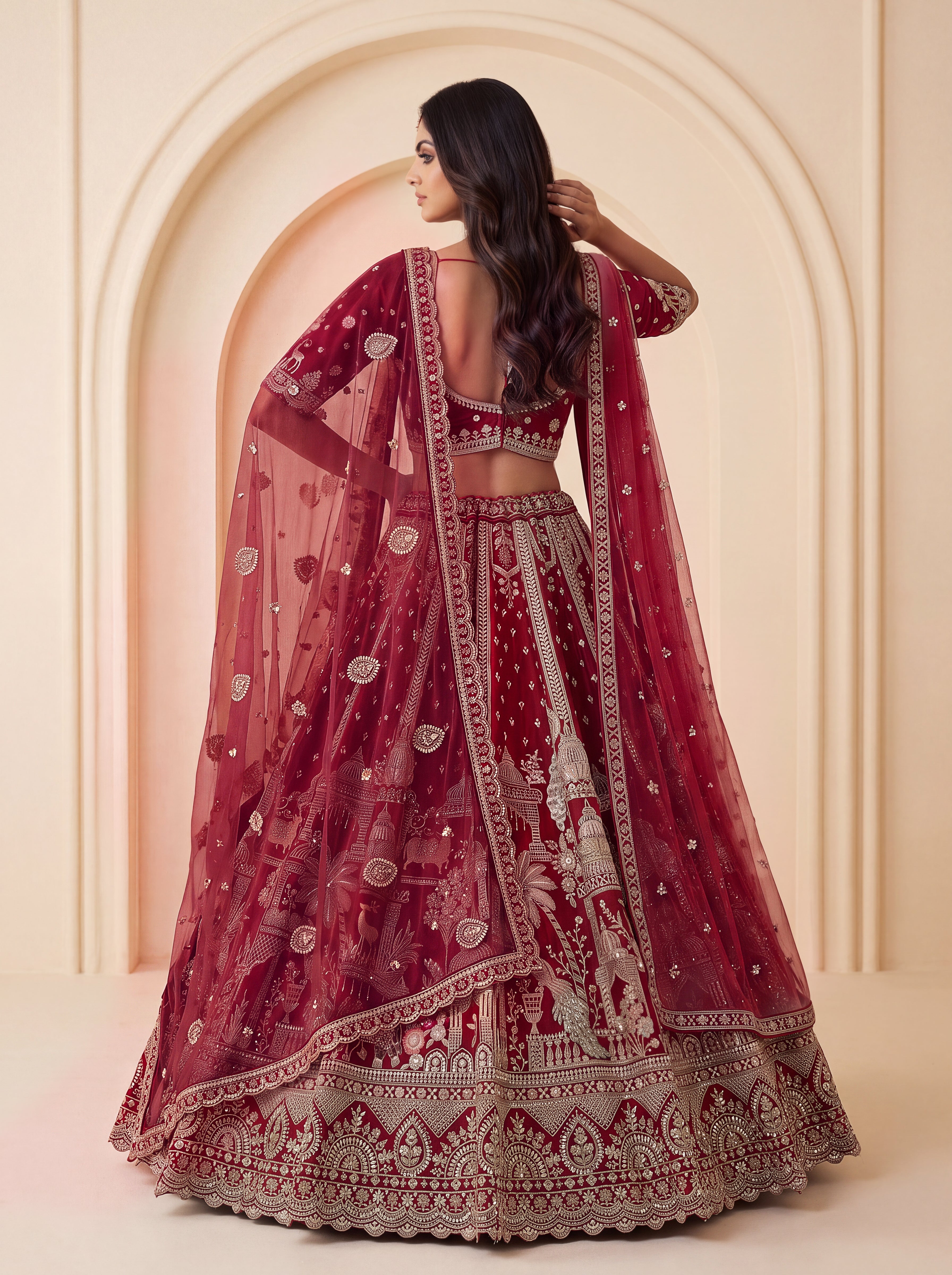 The Vrindavan Sanctuary Deep Maroon Heavy Embroidered Bridal Lehenga Choli with Cutwork Net Dupatta