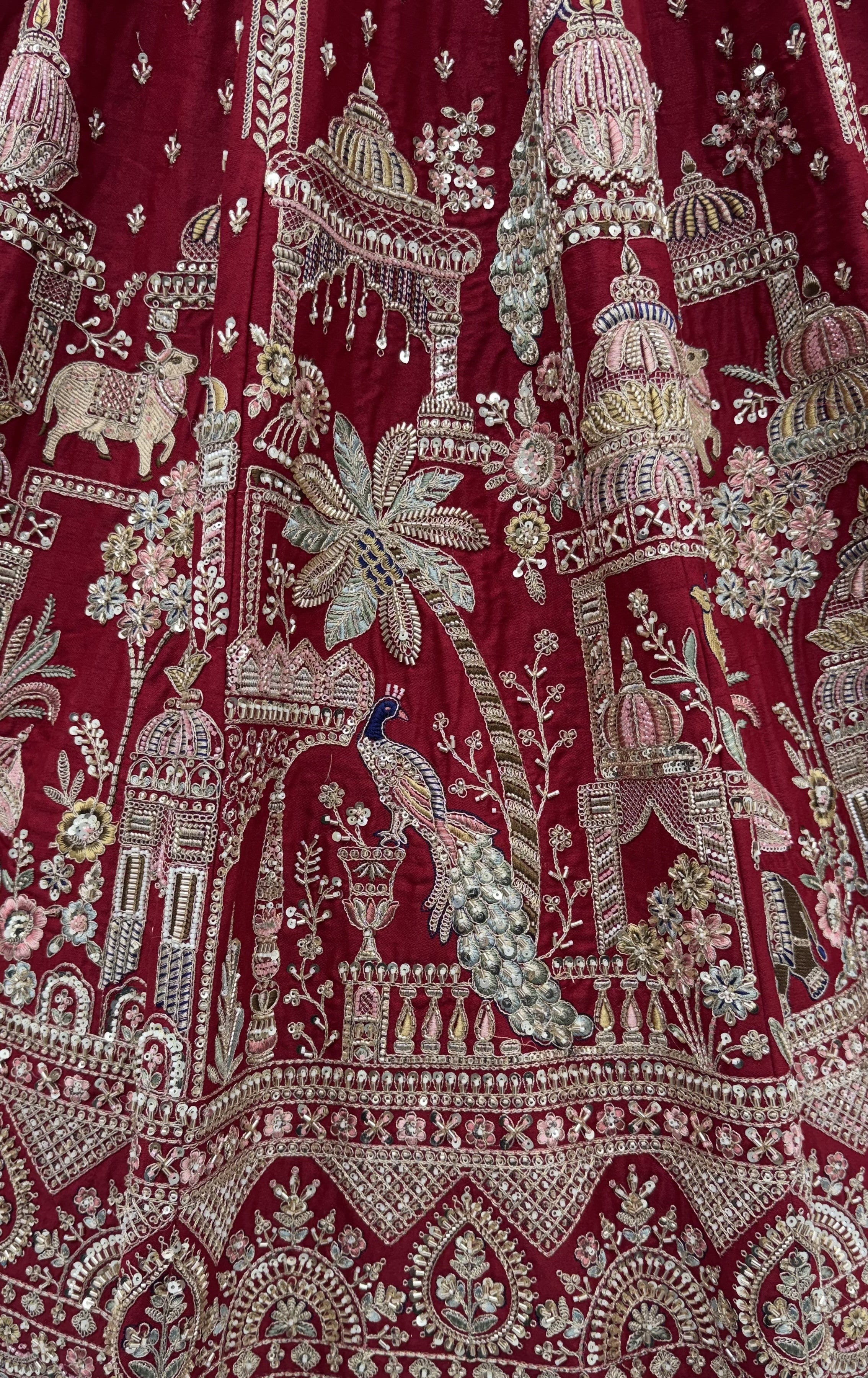 The Vrindavan Sanctuary Deep Maroon Heavy Embroidered Bridal Lehenga Choli with Cutwork Net Dupatta