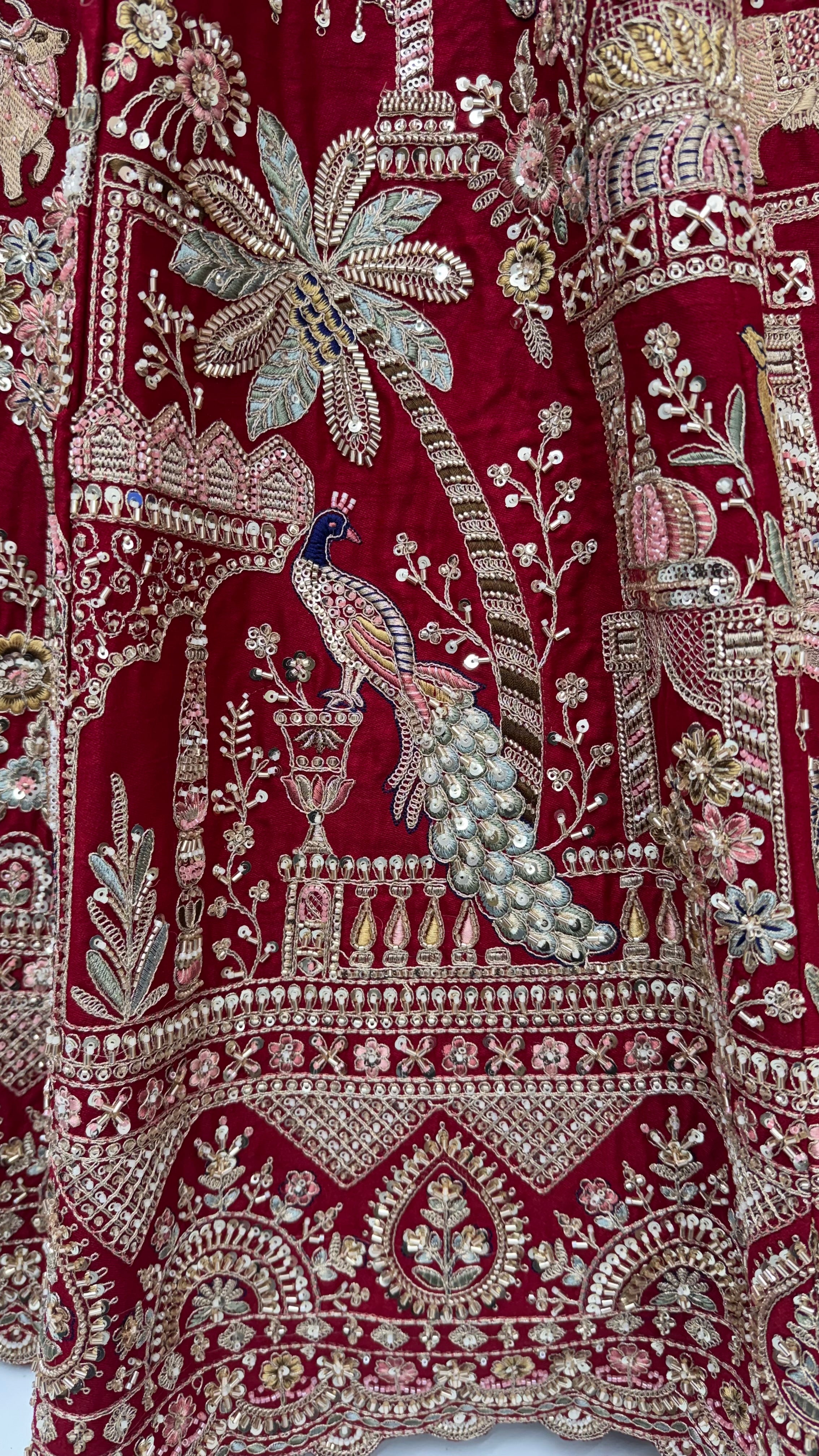 The Vrindavan Sanctuary Deep Maroon Heavy Embroidered Bridal Lehenga Choli with Cutwork Net Dupatta