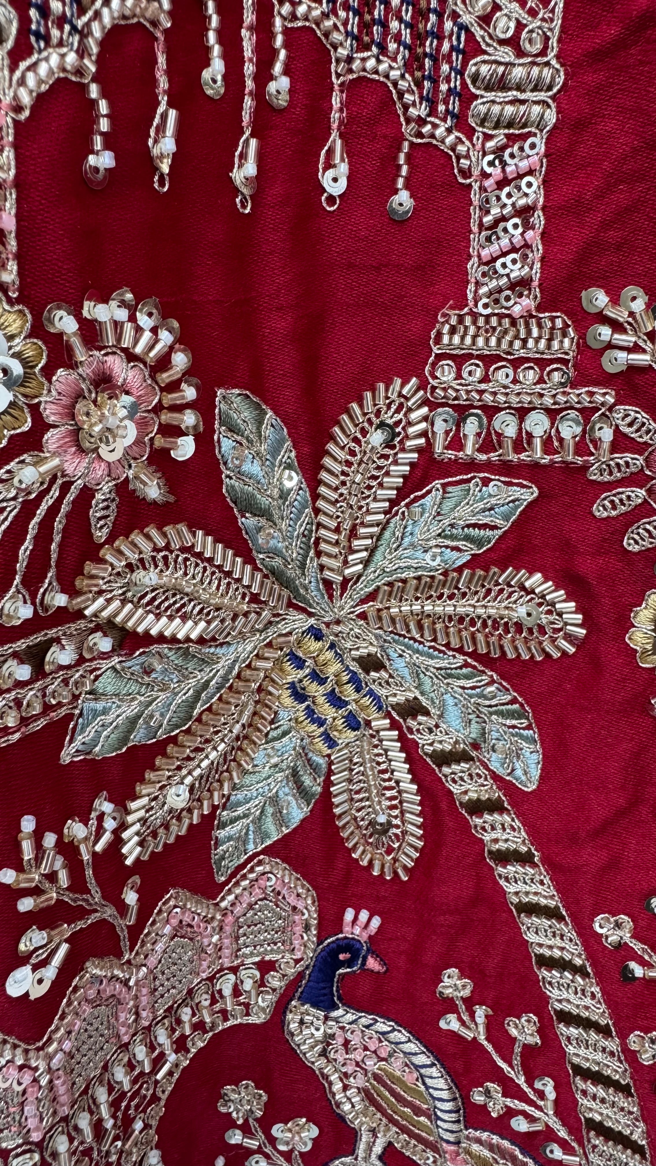 The Vrindavan Sanctuary Deep Maroon Heavy Embroidered Bridal Lehenga Choli with Cutwork Net Dupatta