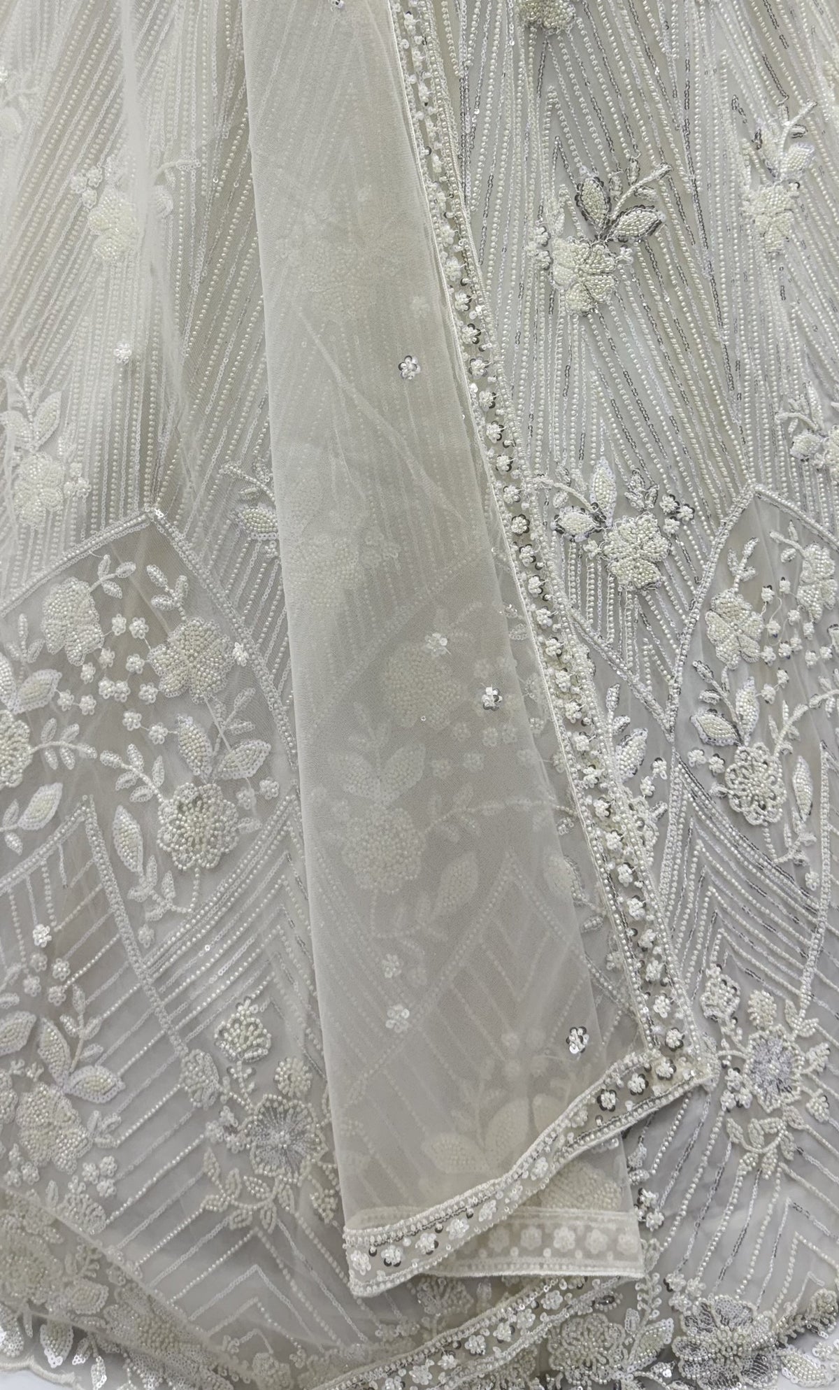 The Inaya Ivory White Embroidered Lehenga Choli, close-up 1
