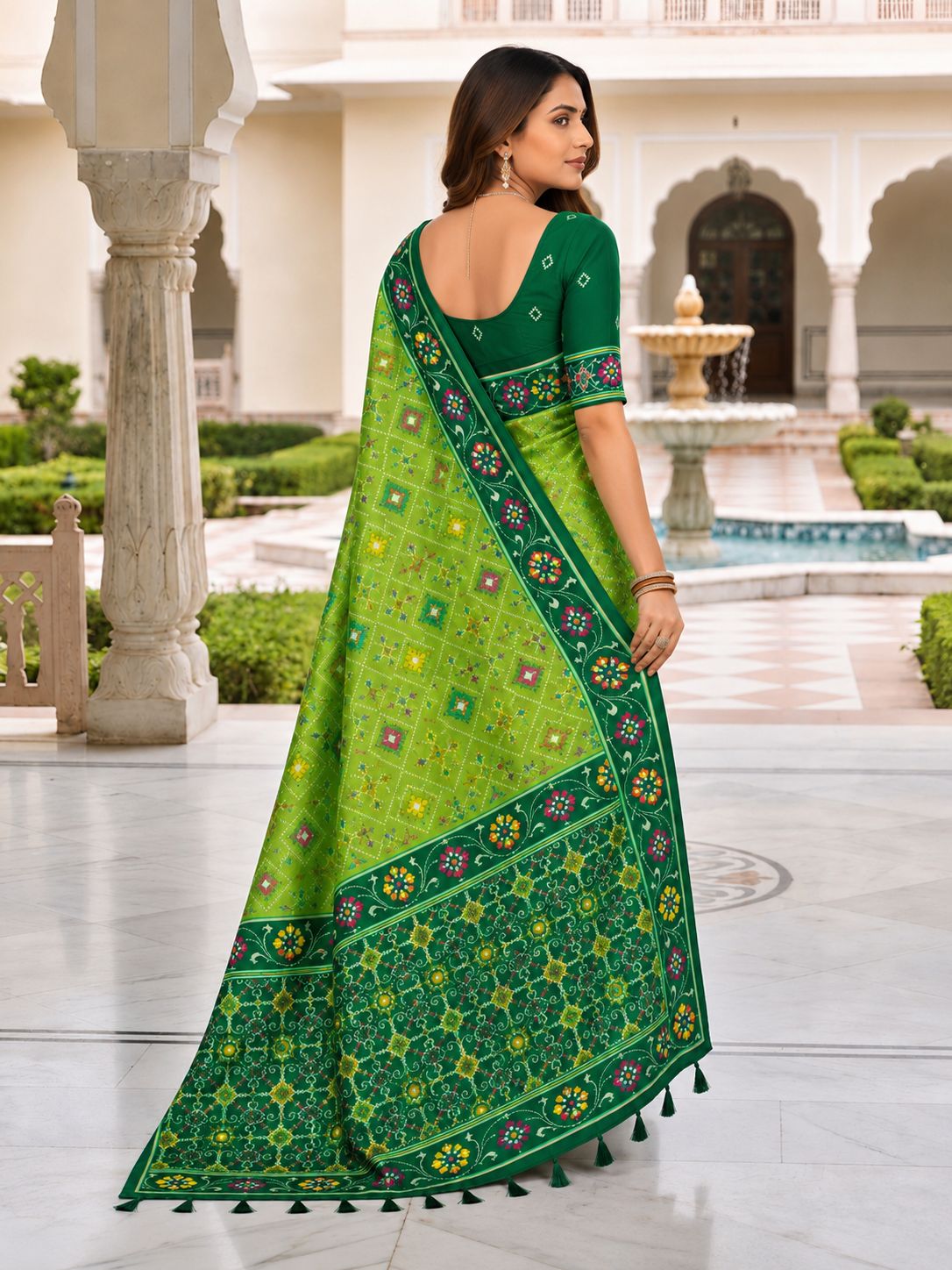 Elegant Green Printed Designer Saree with Floral Border & Tassel Pallu